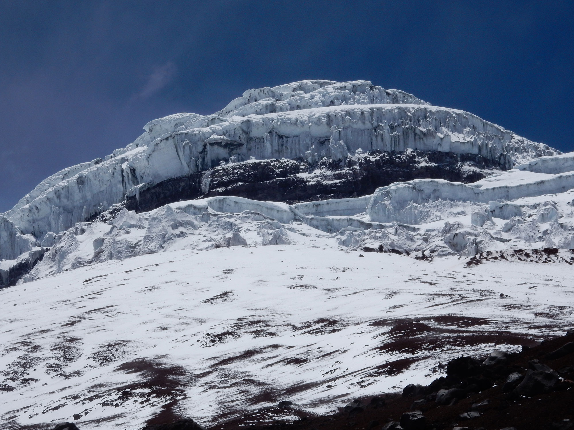 The snow and ice covered peak of the Cotopaxi volcano